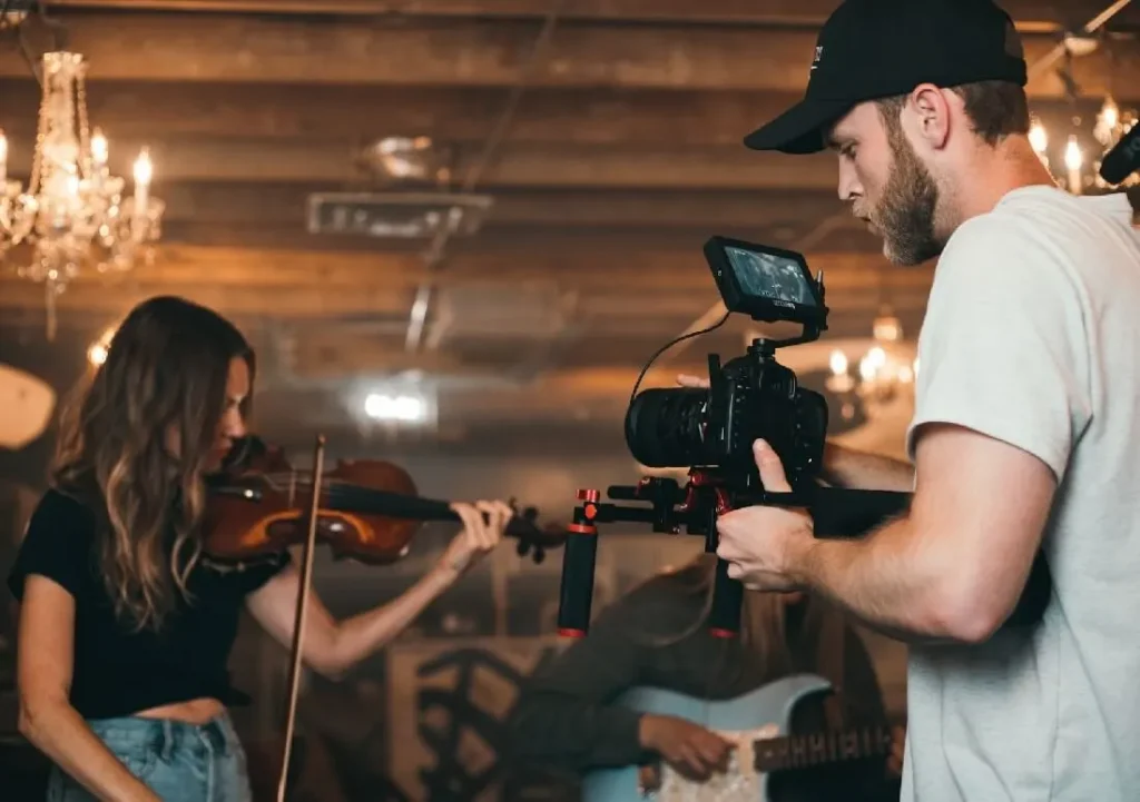 Movie extra playing violin on film set
